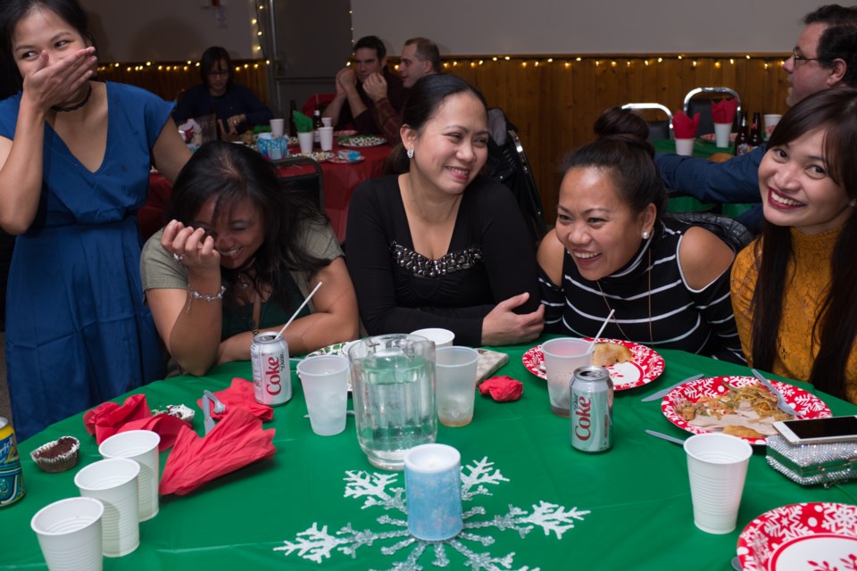 (From Left) Mona, Beth, Weng, Theresa, and Khai had a laugh at the Filipino-Canadian Community of Sault Ste. Marie's Christmas party at the Moose Lodge on Sunday. Jeff Klassen/SooToday