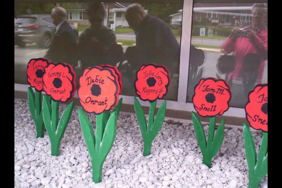 Royal Canadian Legion Branch 25 members planted wooden poppies in memory of veterans and other loved ones Monday June 6, 2016.  Photo supplied by Helen Stewart, Royal Canadian Legion Branch 25.