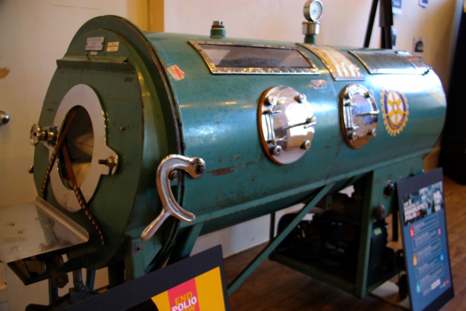 A device known as an iron lung, which was used in years past to treat polio, on loan to the Sault Ste. Marie Museum for its current exhibit celebrating Rotary’s 100th anniversary, July 18, 2018, Darren Taylor/SooToday. The iron lung is on loan from a U.S. Rotary club for only two weeks during the exhibit, which continues at the museum until the fall.  