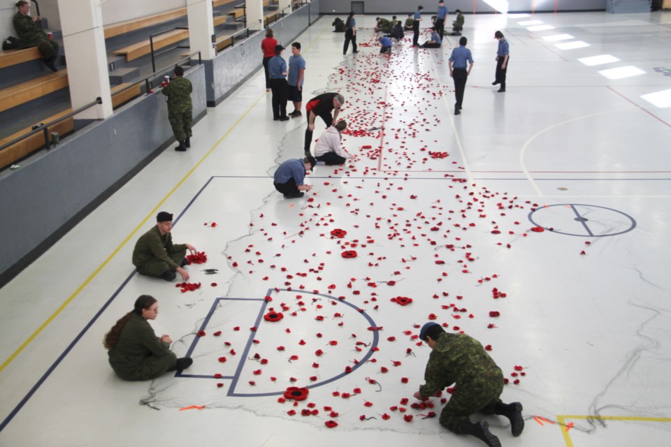 Local army, sea and air cadets gathered at the Sault Ste. Marie Armoury and attached 5,000 crochet poppies to netting to be displayed at the Sault Ste. Marie Museum in time for the start of Royal Canadian Legion Branch 25’s 2023 Poppy Campaign, Oct. 14, 2023.