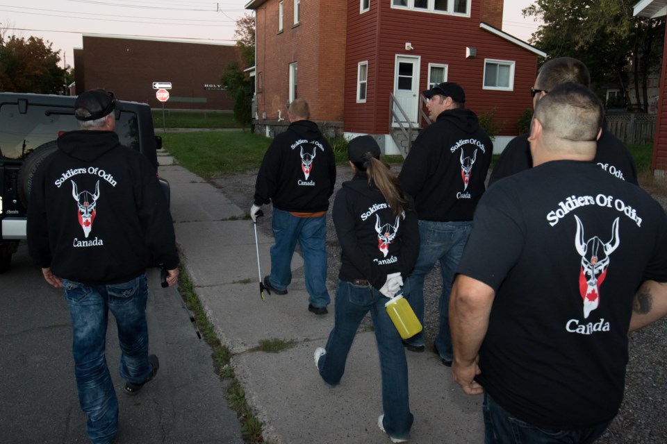 The controversial group Soldiers of Odin are now walking the streets and alleys of Sault Ste. Marie. On Wednesday they were out cleaning up discarded drug needles off the streets while wearing their notorious black uniforms emblazoned with the groups logo. Jeff Klassen/SooToday