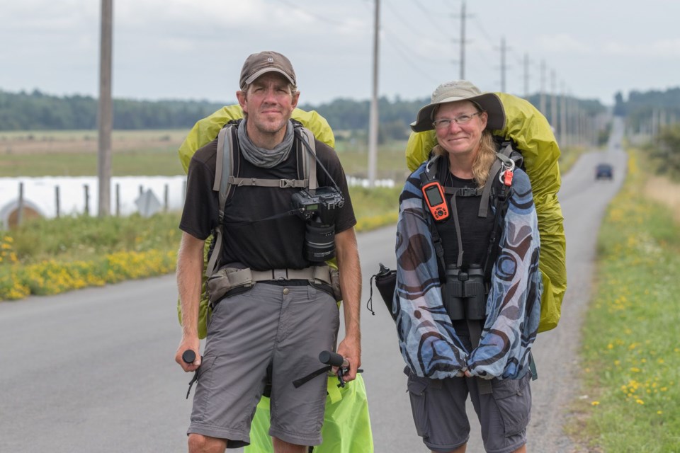 Sean Morton and Sonya Richmond stop to pose for a photo as they approach the Sault from the east. Violet Aubertin for SooToday