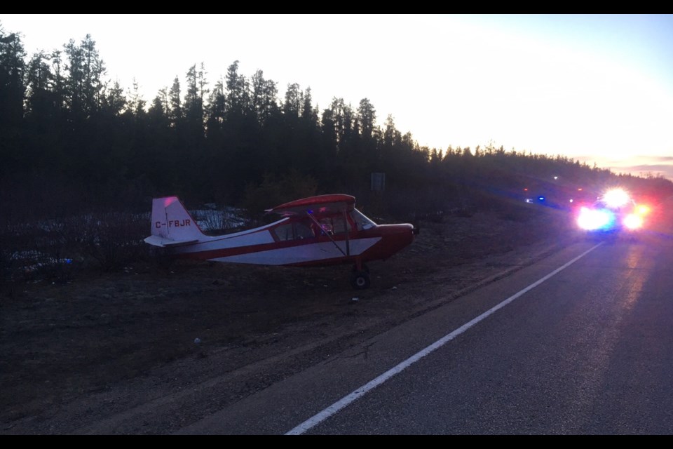 A plane sits to the side of the road after it landed on Highway 129 on Wednesday, April 12, 2017. OPP photo.