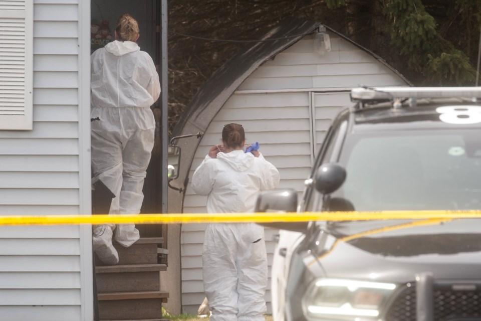 On May 2, 2024, forensics officers with the Sault Ste. Marie Police Service enter the home at 581 Boundary Rd., the scene of a where two people were found dead the previous day.