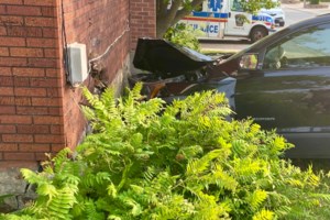 Two-vehicle collision sends SUV crashing into downtown home
