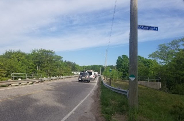 Traffic is backed up at Sixth Line after a collision overnight that sent the driver of a pickup truck to hospital with what police describe as serious injuries