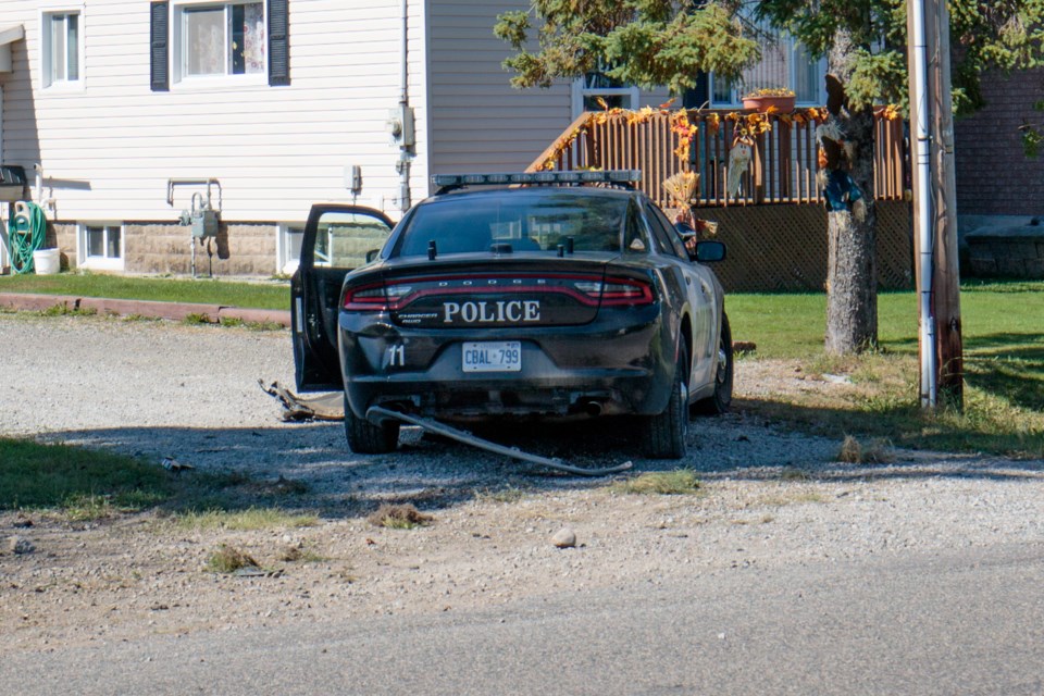 A damaged police car sits askew in a driveway next to tire treads that appear to go over a culvert on Cooper Street on Saturday afternoon, Sept. 30, 2017. Jeff Klassen/SooToday