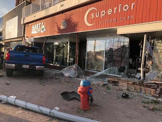 The fronts of Superior Vision Care and Hart Mobility at 246 and 242 Queen Street East were heavily damaged by a single vehicle crash on Sunday evening. Photo submitted by Trina Skagen