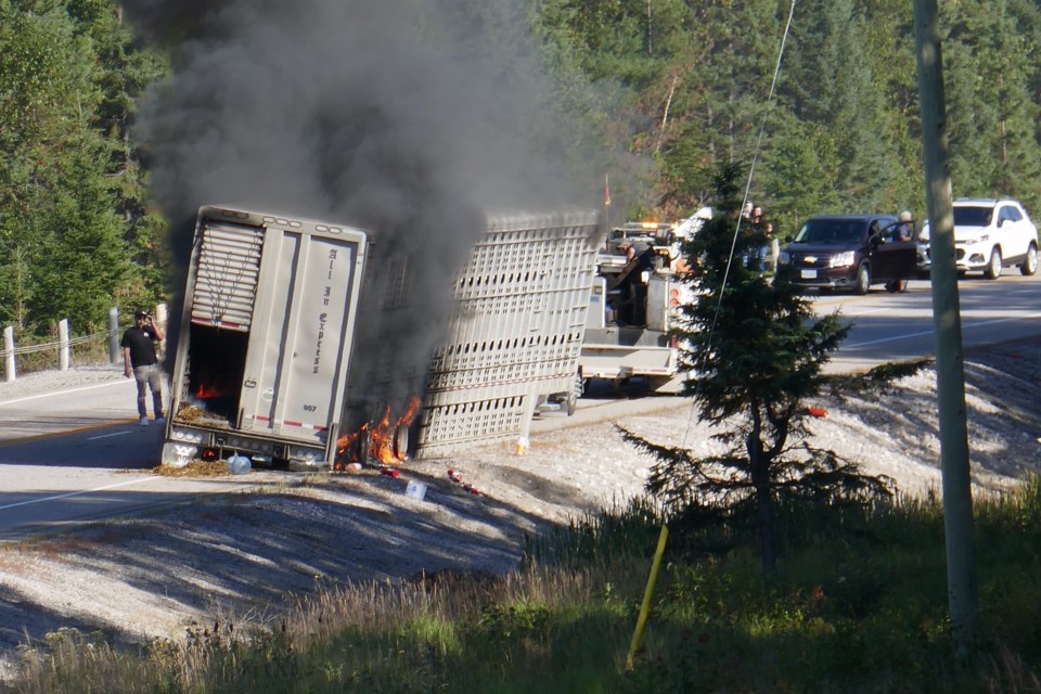 Reader submitted photo shows cattle trailer burning in the eastbound lane of Highway 17 west of Montreal River