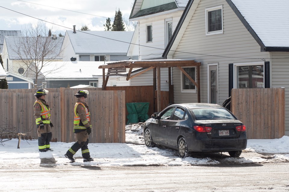 Damage to a fence and deck can be seen after a collision by a single vehicle on MacDonald Avenue at Ferris Avenue on Tuesday afternoon.