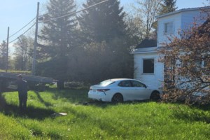 Car veers off the road, crashes into west-end house
