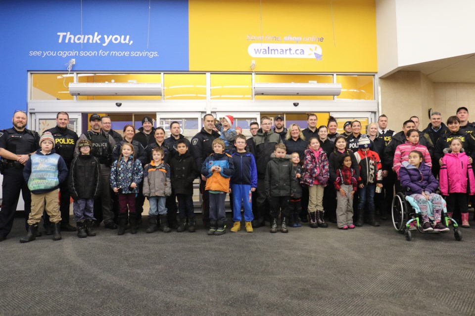 25 kids were paired up with various police and enforcement agencies during the annual Cops and Kids Shopping Day. James Hopkin/SooToday