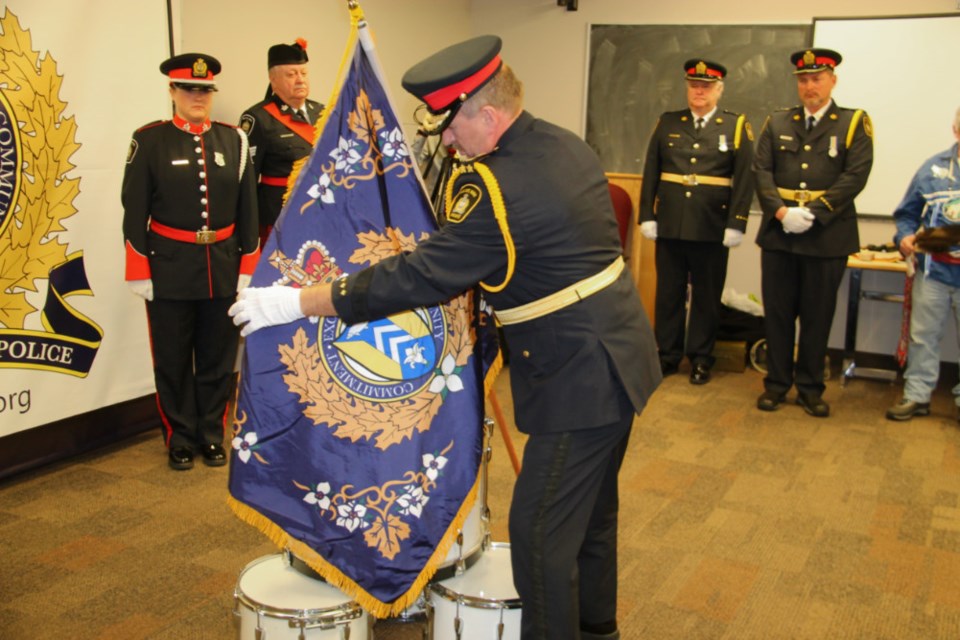 Sault Police Chief Hugh Stevenson covers the drums with the Sault Police flag at a traditional drumhead ceremony to bless the flag at the Sault Police Service building, Nov. 22, 2018. Darren Taylor/SooToday