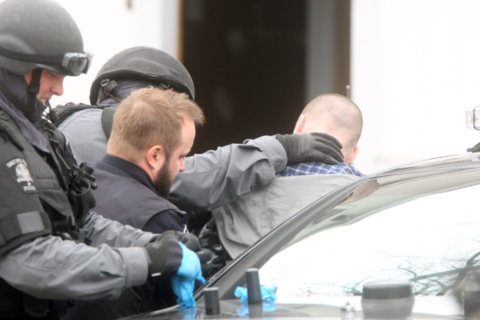 A man is taken into custody by officers with the Sault Ste. Marie Police Service on Apr. 21, 2017 on St. James Street. Kenneth Armstrong/SooToday