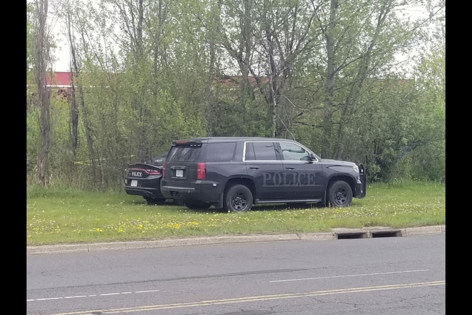 Police presence in bushes off Carmen's Way on May 19, 2021.