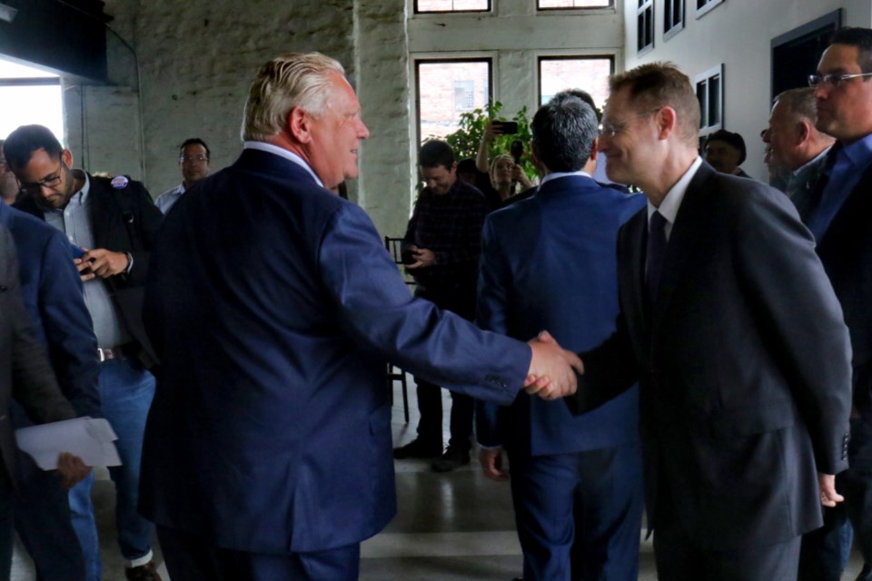 Ontario PC leader Doug Ford greets Jorge Mitre during an election campaign stop Friday at The Machine Shop. It was Mitre's last day on the job as operations manager at Tenaris Algoma Tubes. James Hopkin/SooToday