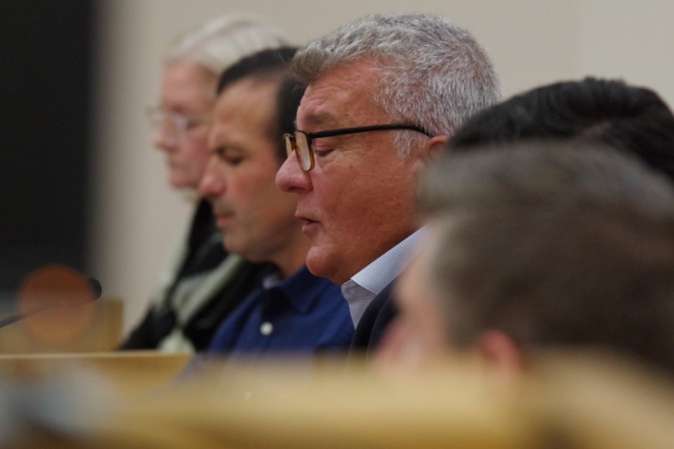 Mayoral candidate Robert Peace (shown at centre) speaks during Wednesday night's candidate forum at the Ronald A. Irwin Civic Centre