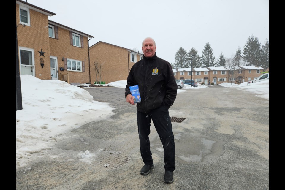 Hugh Stevenson wore a Sault Police Chief jacket on Wednesday while canvassing for the Conservative Party of Canada.