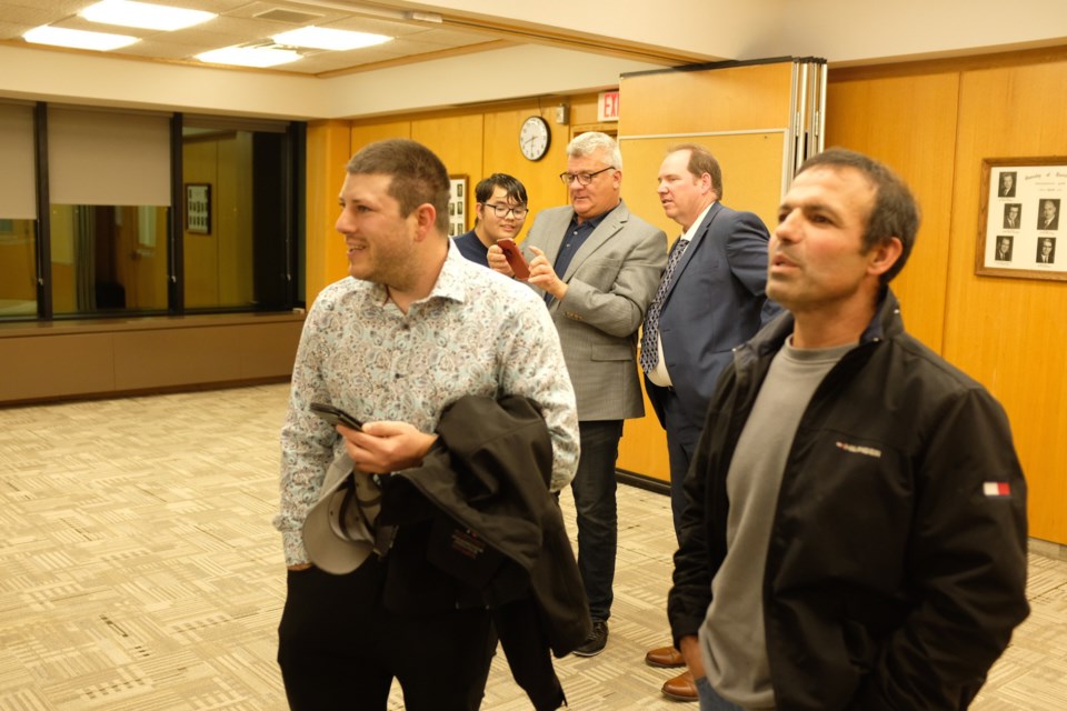 Mayoral candidates Ozzie Grandinetti and Robert Peace watch as the first results are put onscreen in the Russ Ramsay room in the Civic Centre