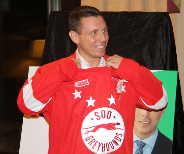 Patrick Brown, Ontario Progressive Conservative leader, tries a Soo Greyhound jersey on for size at a meet and greet in Sault Ste. Marie, Jan. 2, 2017. Darren Taylor/SooToday
