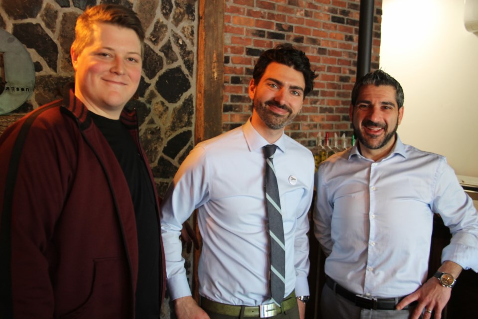 Stephen Jansen, Broers Jansen wine bar co-owner and Josh Ingram, Downtown Association general manager, with Sault MPP Ross Romano at a provincial government funding announcement, May 17, 2019. Darren Taylor/SooToday