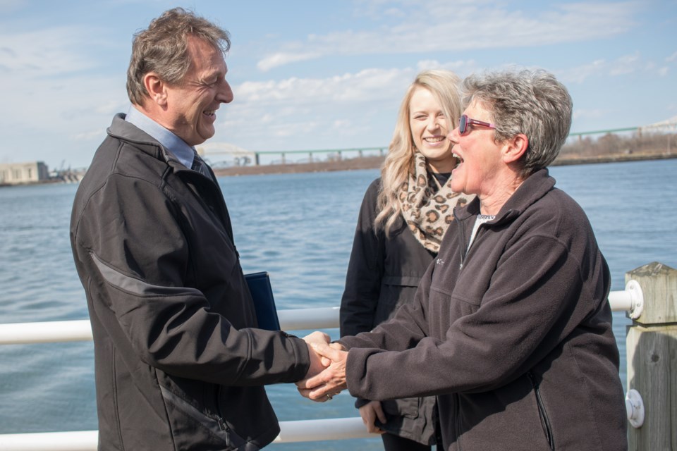Random passerby Liz Heale stopped to shake the hand of NDP 2017 byelection candidate Joe Krmpotich at a press conference on the boardwalk on Thursday. Krmpotich's daughter and campaign-helper Jessica Krmpotich was at his side for the press conference, his first since the byelection date was called. Jeff Klassen/SooToday