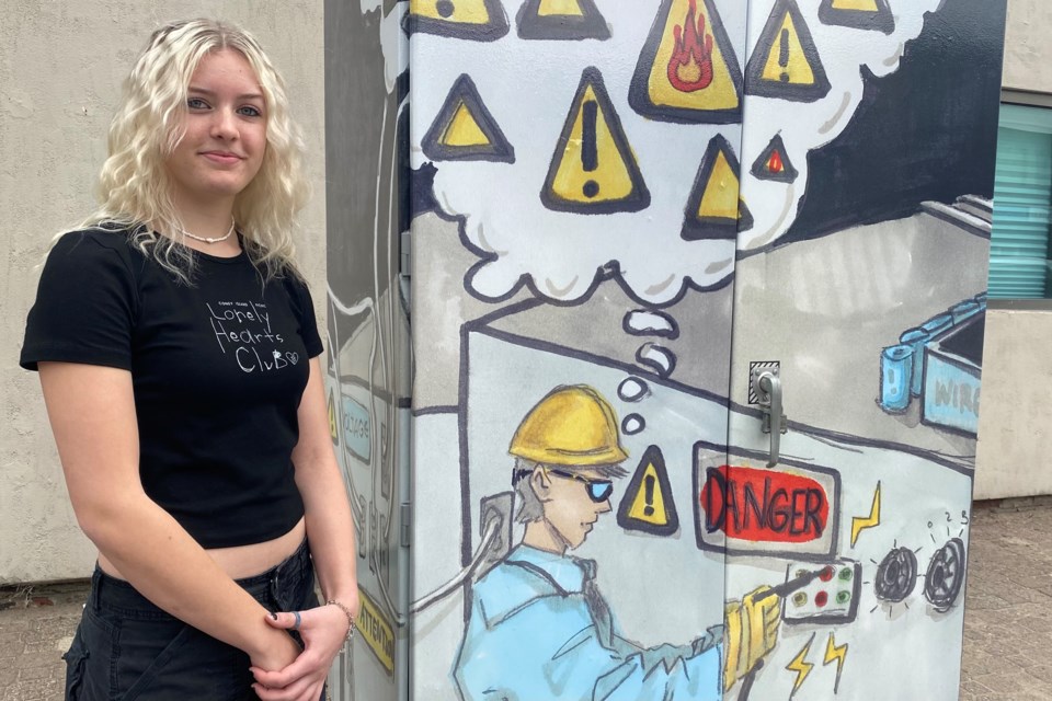 Hailee Devoe designed an artistic wrap for one of six downtown streetlight boxes