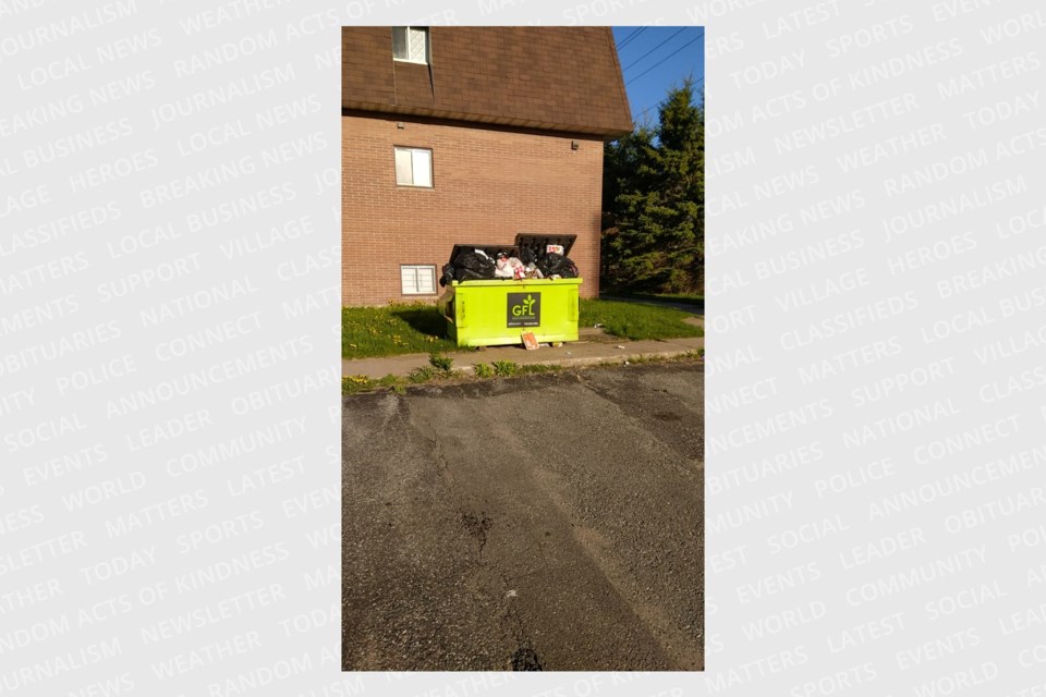 The dumpster outside 980 Wellington St. E had been full for weeks due to non-payment until it was emptied this past Wednesday. The property is managed by CPM Properties and owned by a numbered company that lists CPM co-director Nels Moxness as its sole director. 
