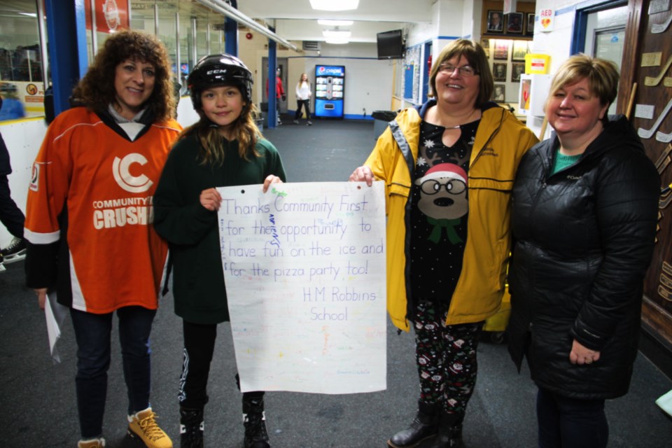 Rose Gioia, Community First, Jordyn Rogers, H.M. Robbins Public School student, Lorrie Morley, H.M. Robbins Public School principal, and Liisa Woolley, Community First, at the Motivate 2 Skate event, sponsored by Community First and held at Community First Soo Pee Wee Arena, Dec. 14, 2018. Darren Taylor/SooToday 