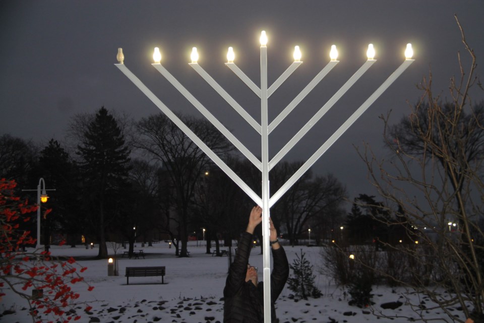 A large menorah was lit outside the Ronald A. Irwin Civic Centre to mark the beginning of the Jewish festival of Hanukkah, Dec. 7, 2023.