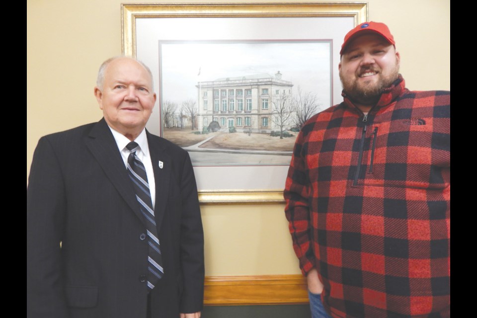 Former Sault, Michigan mayor and city commissioner Bill Lynn, at left, with son Michael. Photo courtesy of Scott Brand/The Sault News
                               