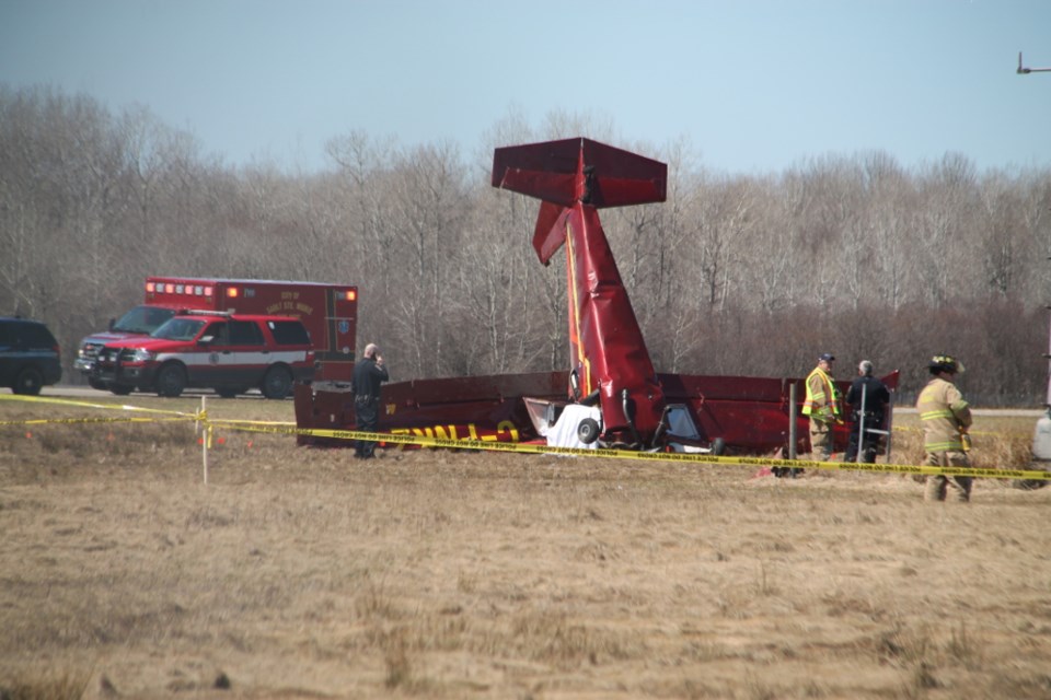 Sault Michigan police, fire and ambulance crews at the scene of a plane crash at Sanderson Municipal Airport involving two fatalities, May 5, 2018. Darren Taylor/SooToday 