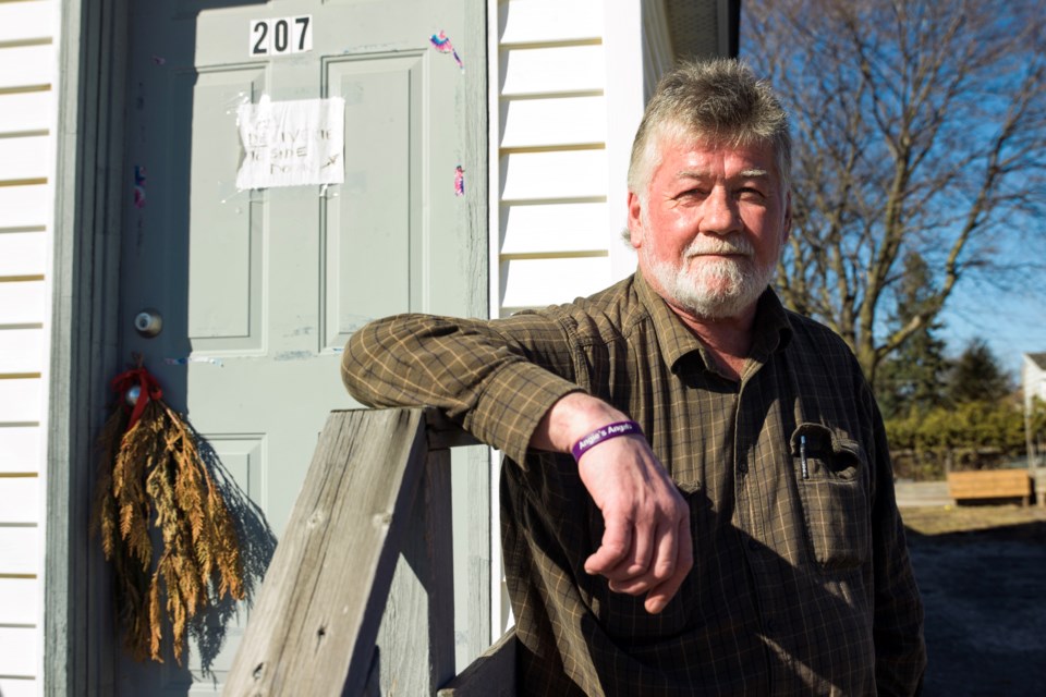 Brian Sweeney stands outside the Tancred Street home where his daughter Angie was killed in October, one of four victims of a mass murder. The Sweeney family is requesting the Office of the Chief Coroner to conduct an inquiry into the Oct. 23, 2023 incident.