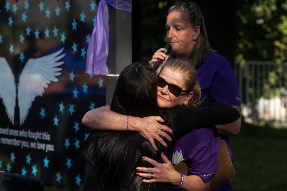 Hugs and support are a big part of the International Overdose Awareness Day event held at the Memorial Wall outside of the Ronald A. Irwin Civic Centre.