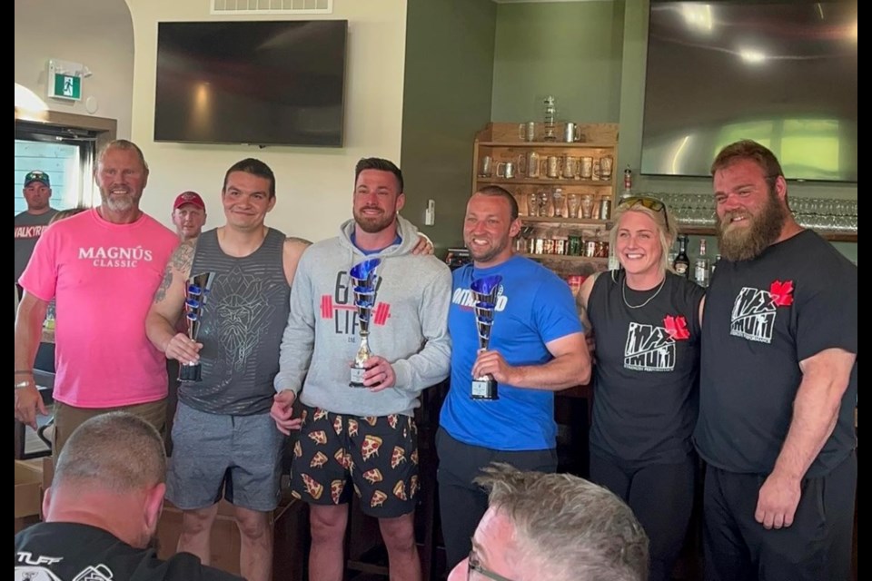 Jared Musgrove (2nd from the left in grey tank) and Scott Dinter (2nd from the left) placed in Ontario's Strongest Man competition last weekend.