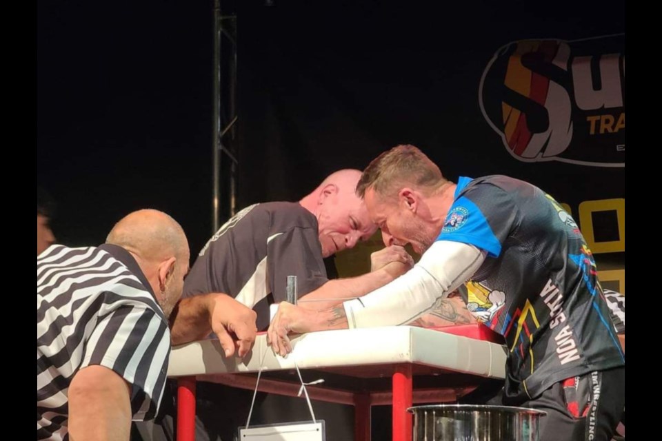 Sault arm wrestler Marty Dimma, at left, competes with Nova Scotia’s Will Sarty at the 2023 Canadian Armwrestling Championship.