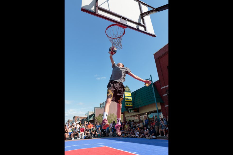 Elijah Suffel, 14, of St. Mary's College particpated in the dunk competition at the Gus Macker 3-on-3 basketball tournament in Sault Ste. Marie, Michigan on Saturday and Sunday. Jeff Klassen/SooToday