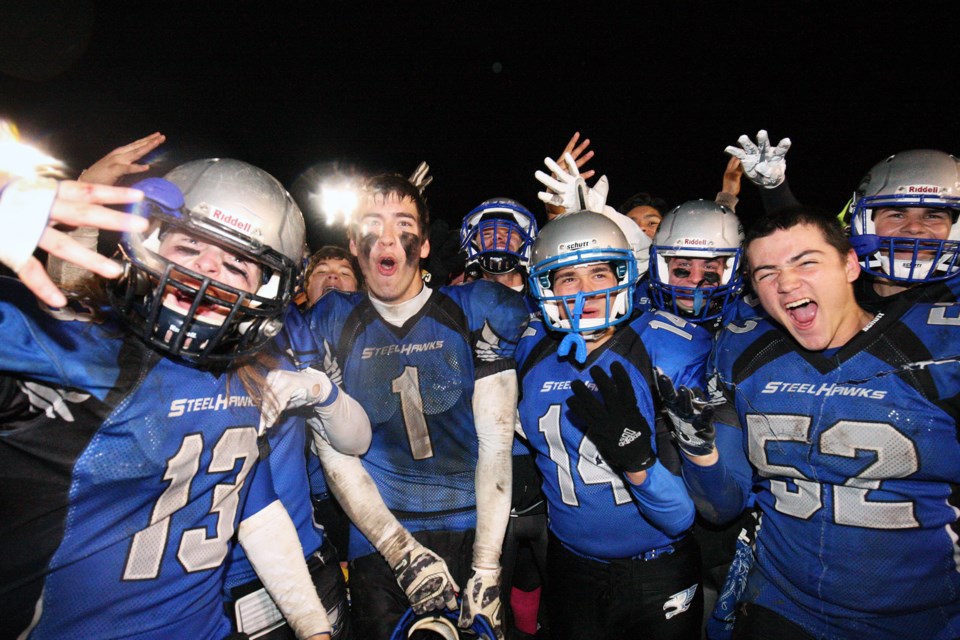 Superior Heights Steelhawks players celebrate their 22-20 win over the Korah Colts tonight at the city high school football final played at Rocky DiPietro Field in Sault Ste. Marie. Kenneth Armstrong/SooToday


