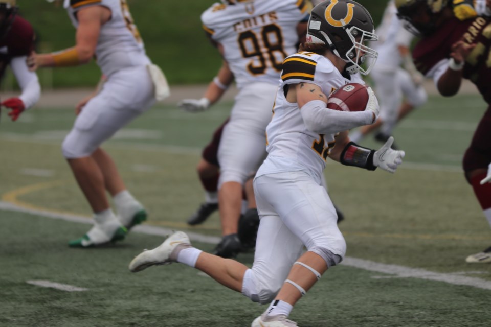 Senior high school football exhibition action between the Korah Colts and Huron Heights Warriors at Superior Heights on Sept. 24, 2022.