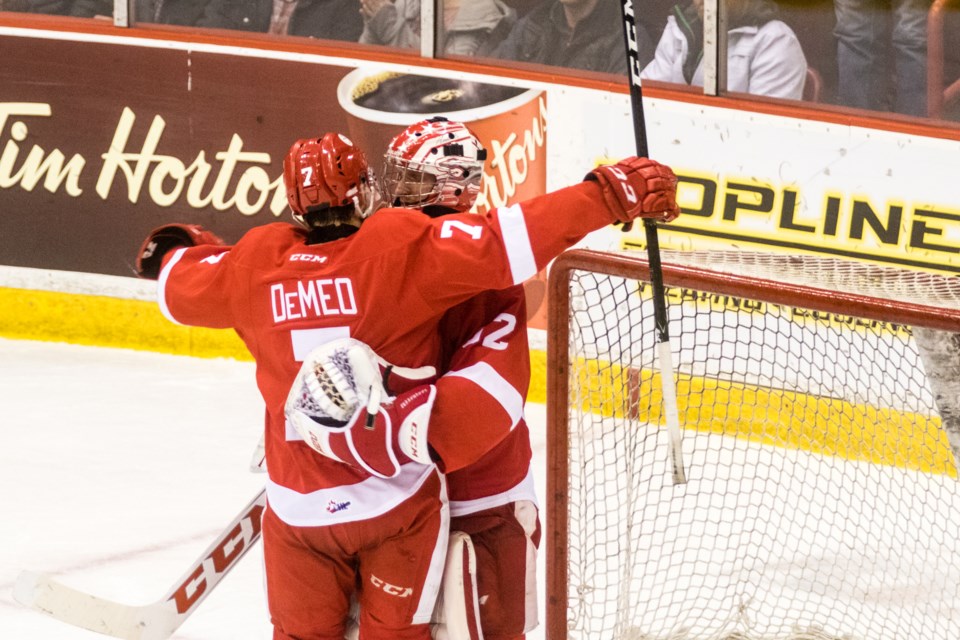 Anthony DeMeo congratulates Joseph Raaymakers as the Soo Greyhounds defeated the Flint Firebirds in game 5 at the Essar Centre on Friday, Mar. 31, 2017. Donna Hopper/SooToday