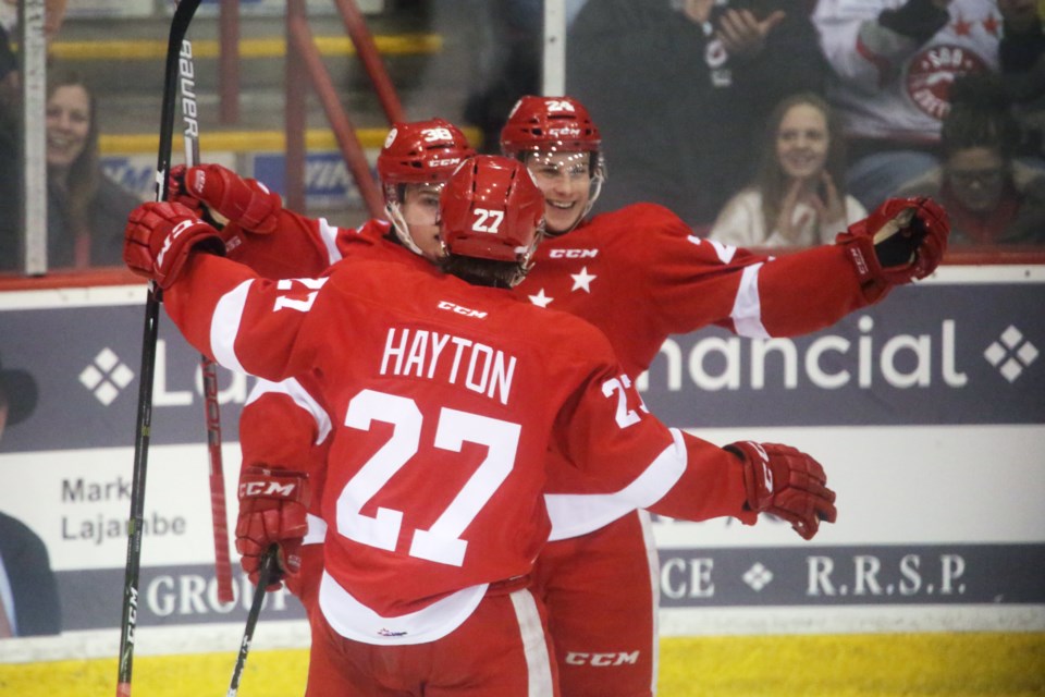 Soo Greyhounds players celebrate a 1st Period goal during Game 1 of their OHL playoff series against the Flint Firebirds March 23, 2017 at the Essar Centre in Sault Ste. Marie. Kenneth Armstrong/SooToday