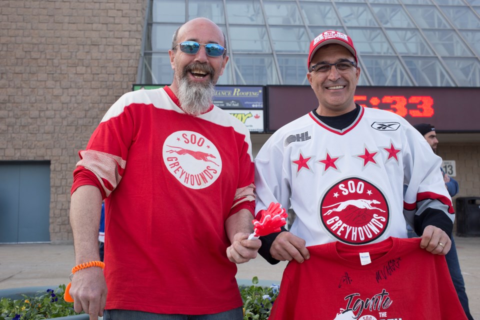 Ron Wiken and Lucio Cesinaro take in Game 3 on Monday at the Aud in Kitchener wearing their Soo Greyhounds jerseys. Kenneth Armstrong/SooToday