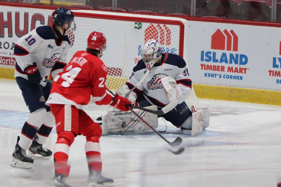 Saginaw Spirit goaltender Tristan Lennox makes a save against the Soo Greyhounds during a game at the GFL Memorial Gardens on Jan. 26, 2022.