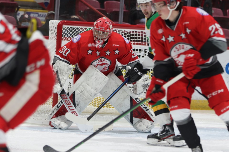 Soo Greyhounds goaltender Tucker Tynan tracks the puck in a game against the London Knights at the GFL Memorial Gardens on Feb. 26, 2022.