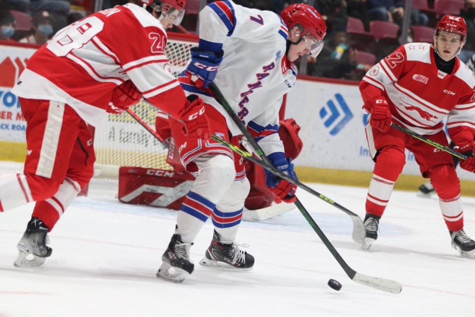 Andrew LeBlanc of the Kitchener Rangers skates the puck into the slot against the Soo Greyhounds in a game at the GFL Memorial Gardens on March 12, 2022.