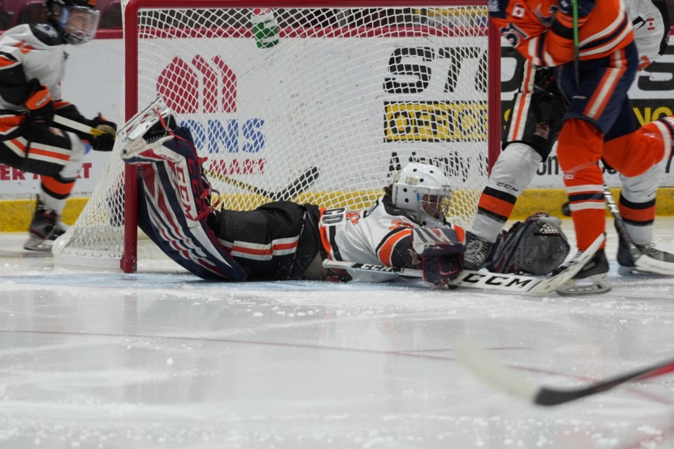 Hearst Lumberjacks goaltender Matteo Gennaro tries to gather a loose puck in a game against the Soo Thunderbirds at the GFL Memorial Gardens on May 2, 2022.