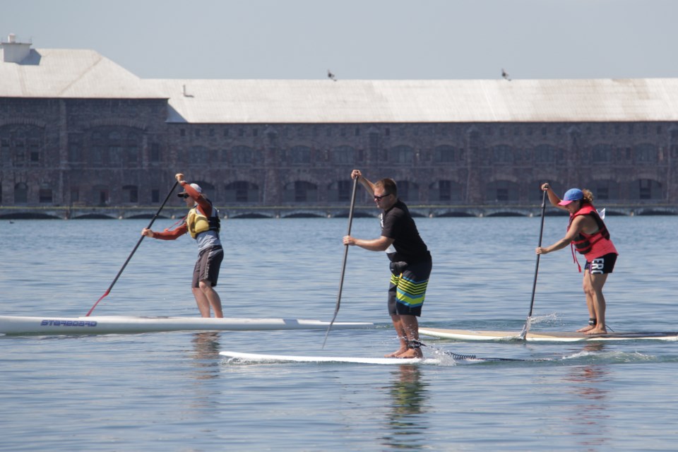 Three competitors participated in a 2.5 km stand up paddleboarding race at the St. Marys River Run Kayak Races on Saturday. Photo by Jeff Klassen for SooToday