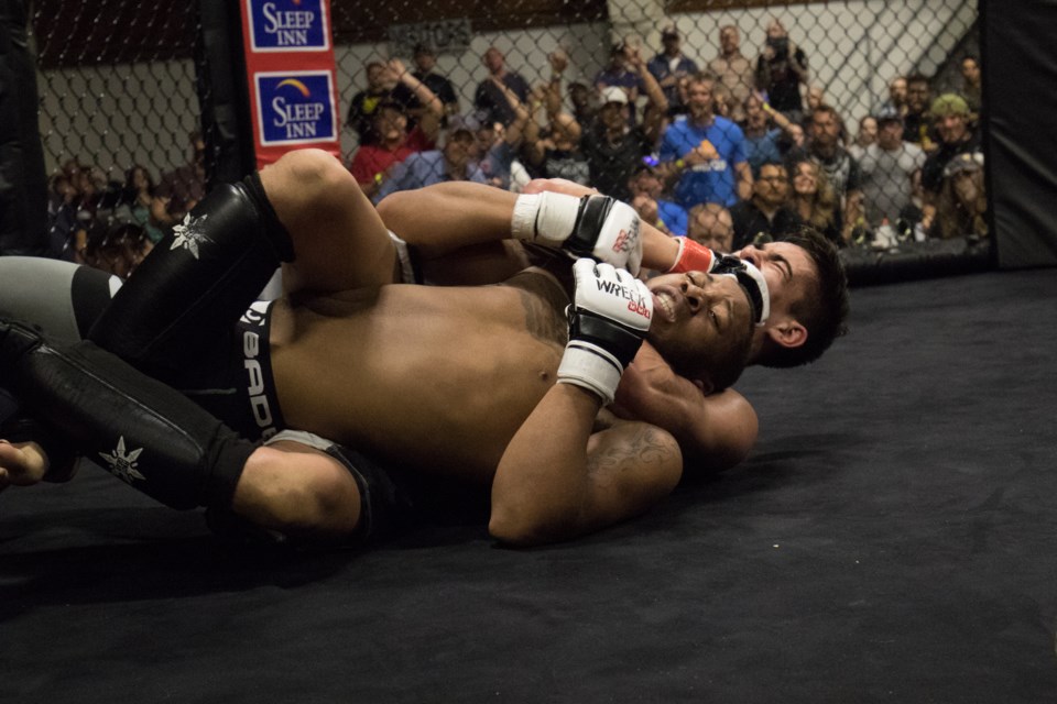 Team Kaos' Maurice Montgomery getting choked by Steel City MMA's Spencer Pine during the Wreck MMA Amateur Fighting Championships at Rankin Arena on May 27, 2017. Jeff Klassen/SooToday