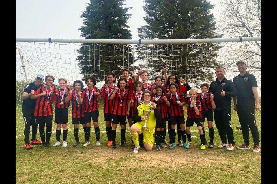 The gold medal-winning Soo City United 2010 Boys soccer team is pictured here from left to right: Coach Jamie Capisciolto, Mason Mazzuca, Ben McKinlay, Luca Cuglietta, Enzo Gonzalez, Martino Coccimiglio, Eli Clowater, Nolan Coudert, Cash Dunn, Owen Moreau, Gage Guzzo, Isaac Sullivan, Luca Capisciolto, Nic Patience, Michael Medeiros, Cy Devries, Alex Derubeis, Assistant Coach Rene Gonzalez, Manager Chris Clowater.