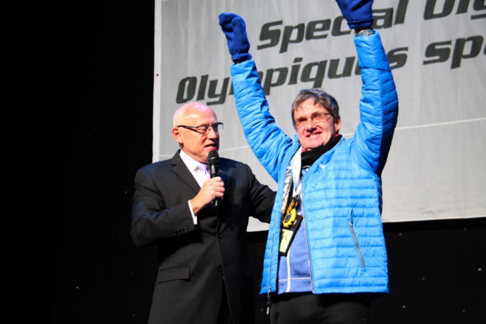 Chris Lewis, Sault native, retired OPP commissioner and Games honorary chair, awards a gold medal to his brother Rob, a Sault Special Olympian, at the 2019 Special Olympics Ontario Provincial Winter Games opening ceremonies, Jan. 31, 2019. Darren Taylor/SooToday